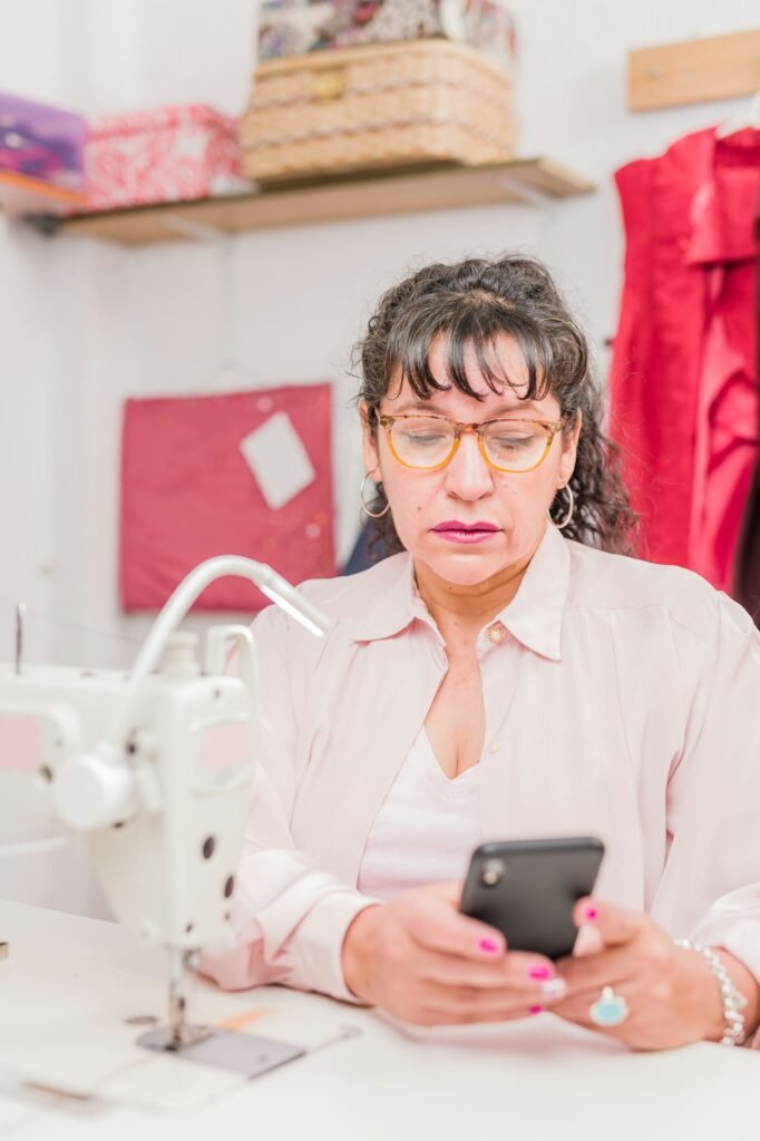 south american latinx professional senior using smartphone for commercial activity. chilean woman