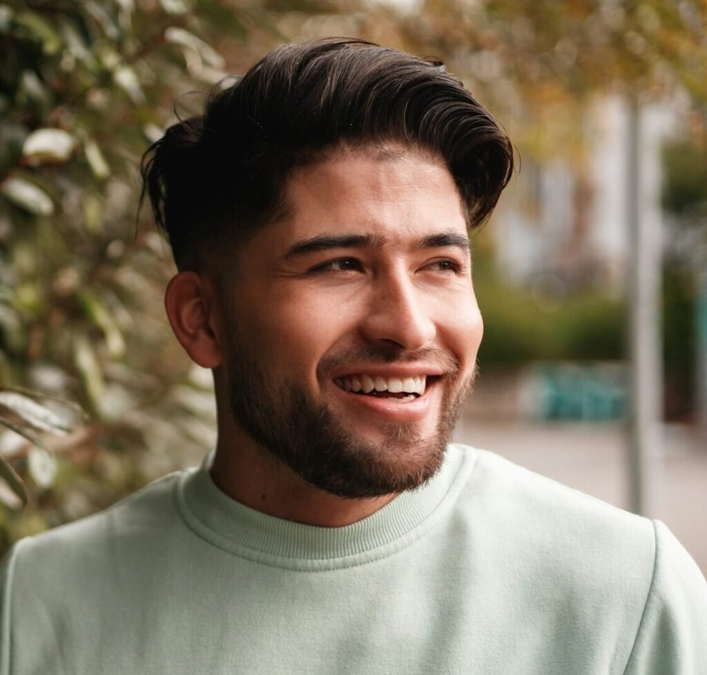 portrait of young colombian man in sportswear in nature