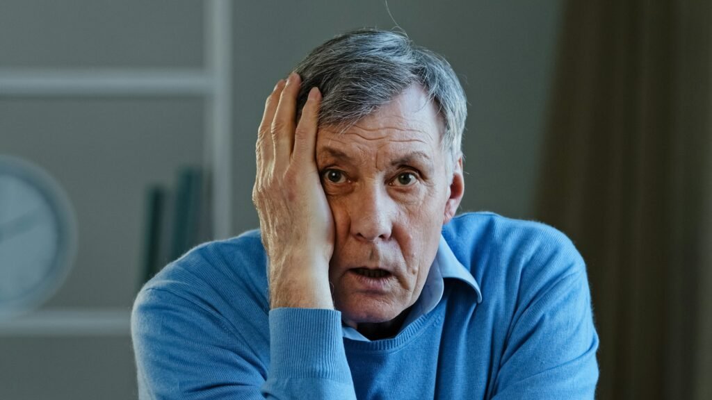 Shocked old senior Caucasian man amazed elderly mature 60s male feeling worried shock fear take off